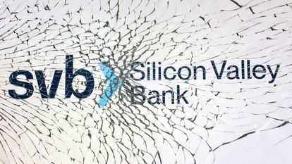SVB (Silicon Valley Bank) logo is seen through broken glass.