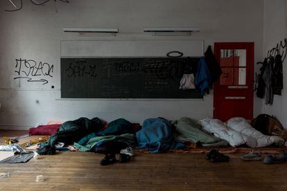 Undocumented teenagers sleep in an abandoned school, Paris, France