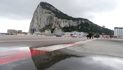 People walk by Gibraltar's airport.