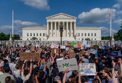 Abortion-rights and anti-abortion demonstrators gather outside of the Supreme Court in Washington, Friday