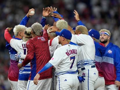 Puerto Rico players celebrate a 10-0 win over Israel with an 8th inning run-rule walk off and a combined perfect game during a World Baseball Classic game, on March 13, 2023, in Miami.