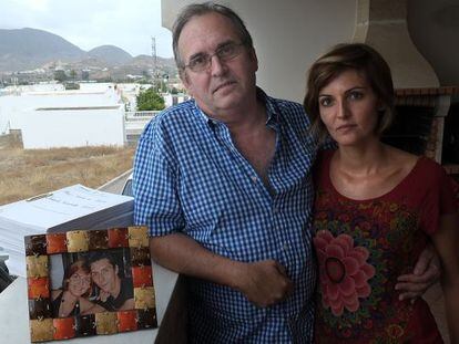 Joaquín Amills and his daughter alongside a photo and the case file of his missing son.