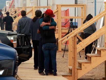 People share a moment at the Tselletkwe Lodge, a safe place for Indigenous evacuees and others who've been displaced due to the wildfires in Kamloops, B.C., Canada, August 22, 2023.