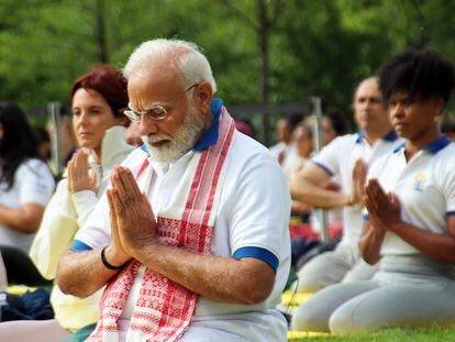 Indian Prime Minister Narendra Modi practices yoga with hundreds of people at the United Nations headquarters.