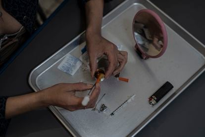 A man prepares a dose of fentanyl in Tijuana.