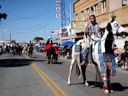 Raquel Sam, a member of the Navajo Nation, rides a horse in a downtown parade at the 100th Gallup Inter-Tribal Indian Ceremonial on August 13, 2022, in Gallup, New Mexico.