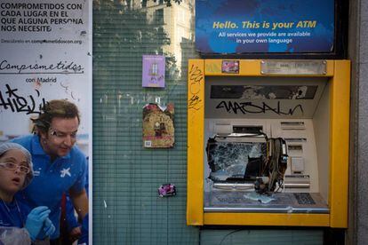 A vandalized ATM in Lavapiés.