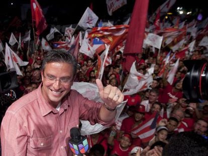 Alejandro Garc&iacute;a Padilla celebrates his victory in the gubernatorial race on Tuesday night with supporters in San Juan. 