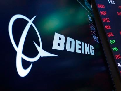 The logo for Boeing appears on a screen above a trading post on the floor of the New York Stock Exchange, July 13, 2021.