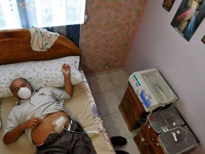 One of the victims of the lethal cough syrup, Adolfo Nieto, undergoes dialysis at his home in Chorrera, west of Panama City.