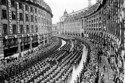 Thousands of people filled the streets of London to watch the parade of British Army soldiers preceding the coronation ceremony of Queen Elizabeth.