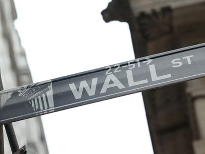 A street sign marks Wall Street outside the New York Stock Exchange in New York City, on February 24, 2022.