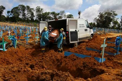 Cemetery workers burying a coronavirus victim in Manaus, Amazonas state, Brazil, on January 6.