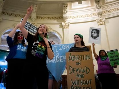 Sarah Bentley, second from left, leads songs at an International Women's Day Sit-In for Abortion Rights in the Texas state Capitol Rotunda, on March 8, 2023, in Austin, Texas.