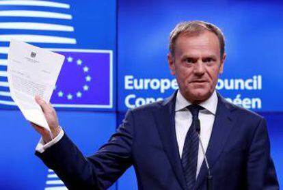 European Council President Donald Tusk shows the Brexit letter detailing the UK's intention to leave the EU.