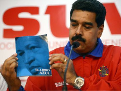 Maduro shows the so-call "Blue Book" which contains Chávez thought.
