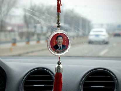 Chinese President Xi Jinping’s portrait adorns a driver’s lucky charm.