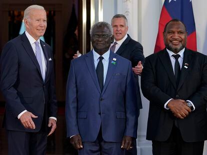 President Joe Biden poses for photos with Pacific Island leaders including Solomon Islands Prime Minister Manasseh Sogavare, center, and Papua New Guinea Prime Minister James Marape on the North Portico of the White House in Washington, Sept. 29, 2022.