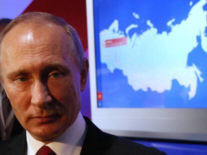 Russian President Vladimir Putin attends the Community Forum in Moscow.