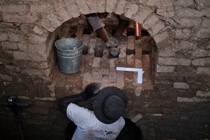 Members of the Search Unit for Disappeared Persons (UBPD) excavate the clay ovens hidden underground