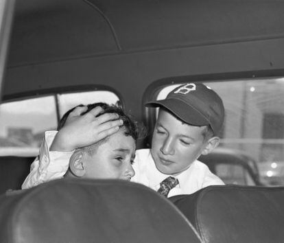 Rosenbergs' son Michael comforting his younger brother Robert after visiting their parents in prison in 1953.
