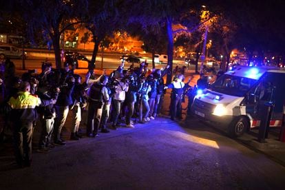 Reporters take pictures of a police van, allegedly carrying soccer player Dani Alves, outside the Barcelona courthouse, Spain, Friday, Jan. 20, 2023.