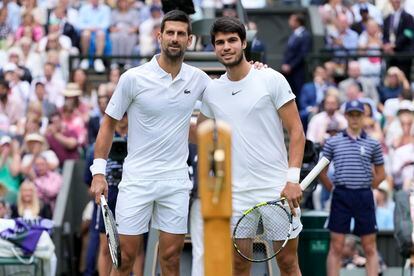Serbia's Novak Djokovic, left, and Spain's Carlos Alcaraz pose for a photo ahead of the final of the men's singles on day fourteen of the Wimbledon tennis championships in London, Sunday, July 16, 2023.