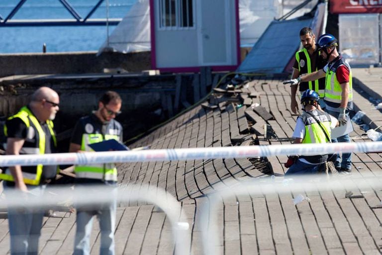 Police investigate the collapsed promenade.
