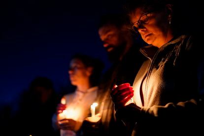 People gather at a vigil in Lisbon Falls, Maine, for victims of the week's mass shootings, Saturday, Oct. 28, 2023.