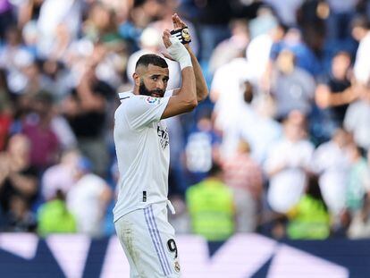 Real Madrid's French forward Karim Benzema applauds during the Spanish league football match between Real Madrid CF and Real Betis at the Santiago Bernabeu stadium in Madrid on September 3, 2022.