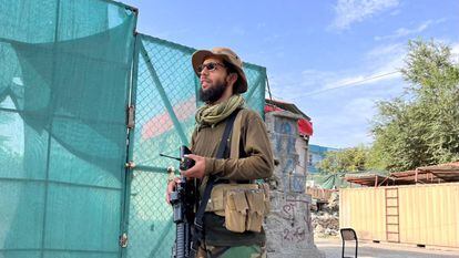 A Taliban militant at the site where the US says it killed Ayman al-Zawahri.