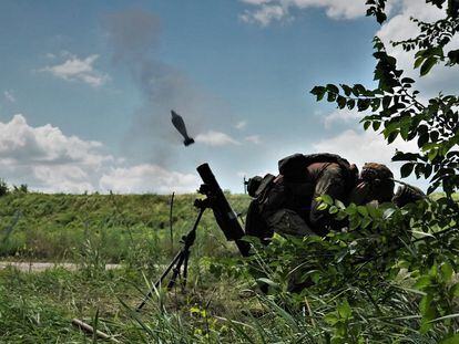 Artem and Sergey launch a mortar towards Russian positions on the Zaporizhzhia front on June 16.