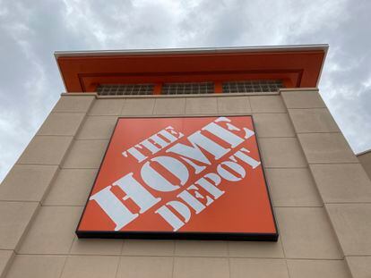 A Home Depot logo sign hands on its facade, Friday, May 14, 2021, in North Miami, Fla.  Home Depot reports their financial earnings on Tuesday, Feb. 21, 2023.