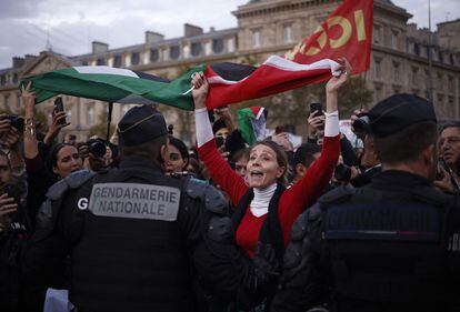 People with Palestine flags shout slogans at the 'Place de la Republique' during a demonstration to support the Palestinian people, in Paris, France