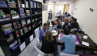 Customers playing away at the Epic Board Game Cafe, in Madrid.