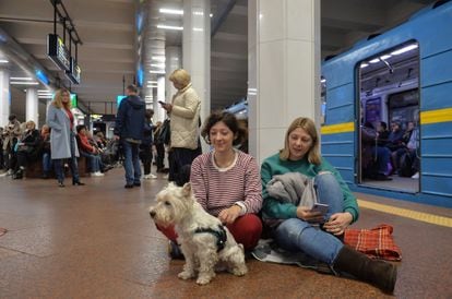 Residents of Kyiv sheltering with their pets in subway stations on Monday.