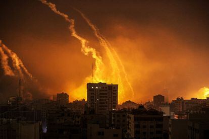 Columns of smoke rise from the Gaza Strip in the early dawn; October 28,2023.