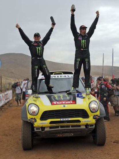 Nani Roma (r) and copilot Michel Perin celebrate their Dakar 2014 victory.