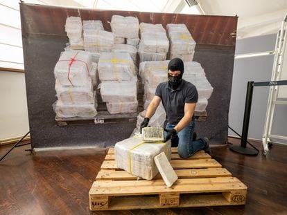 A customs officer in Munich, Germany, displays a package from what was the largest cocaine seizure in the Bavarian region, in July 2022.