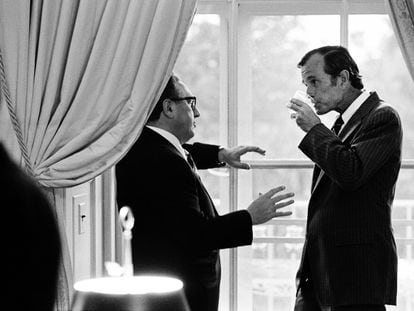 Henry Kissinger, then Secretary of State under President Gerald Ford (he replaced Richard Nixon after resigning days before), talks on August 28, 1974, with George Bush, then Head of the United States Liaison Office with the People's Republic of China, in the White House.