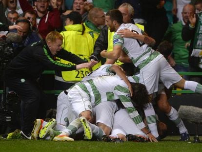 Celtic&#039;s manager Neil Lennon (l) joins in the celebration of the winning goal against Shakhter Karagandy during their Champions League playoff round second leg at Celtic Park.  
