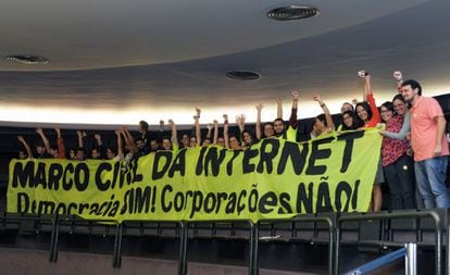 A group of activists celebrates the passing of Brazil's new internet law on Tuesday.