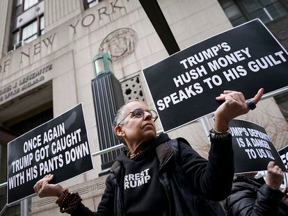 Protesters against former President Donald Trump pace the sidewalks outside the public entrance to the 80 Centre Street building on March 27, 2023, in New York.