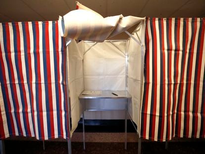 A booth is ready for a voter, Feb. 24, 2020, at City Hall in Cambridge, Mass., on the first morning of early voting in the state.
