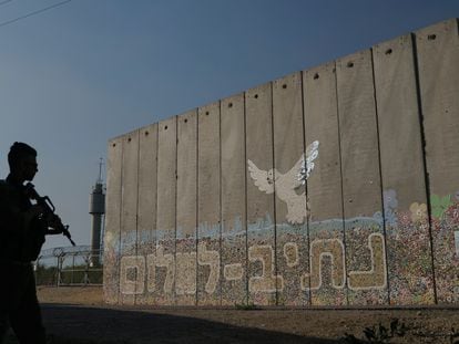 A security wall with Hebrew writing reading "Path to Peace" at the Kibbutz Netiv Haasara near the border with Gaza Strip.