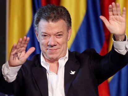 Juan Manuel Santos greets supporters after his victory on Sunday.