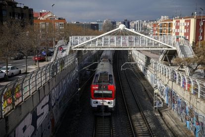 A train entering Entrevías station. Residents say that one of the upsides of living here is that rent is relatively cheap yet they are a short distance away from downtown Madrid thanks to the rail link.