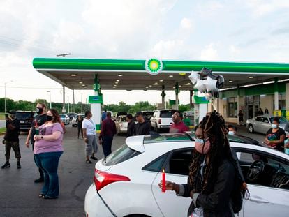 Members of the community gather for a vigil in Kansas City, Missouri, on June 2, 2021, at the BP gas station where Malcolm Johnson was shot and killed by police on March 25.