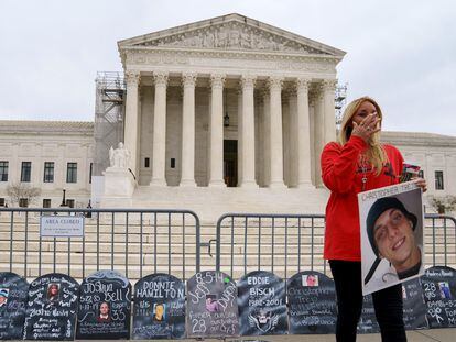 A woman reacts as campaigners and family members of those who have died of opioids gather outside the US Supreme Court, Washington, DC, USA, 04 December 2023.