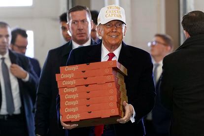 Republican presidential candidate former president Donald Trump arrives to deliver pizza to fire fighters at Waukee Fire Department in Waukee, Iowa, Sunday, Jan. 14, 2024. 